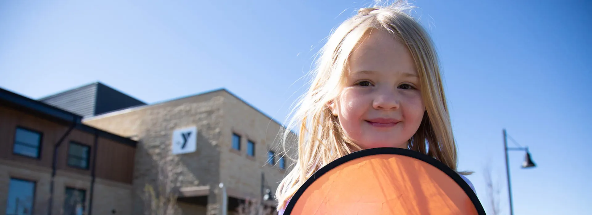 little girl with YMCA frisbee